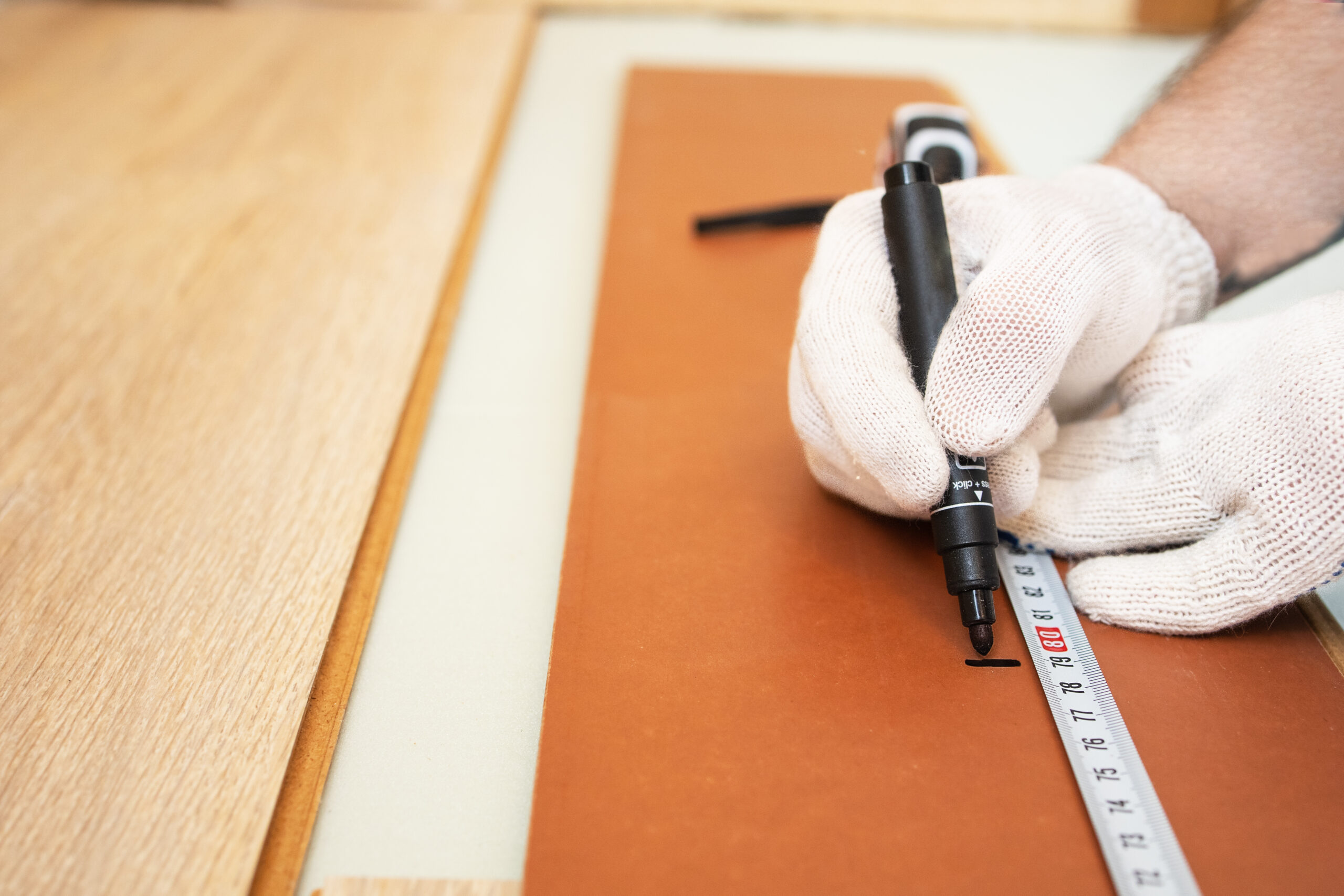 close-up-measurement-of-laminate-flooring-2023-04-26-18-41-20-utc