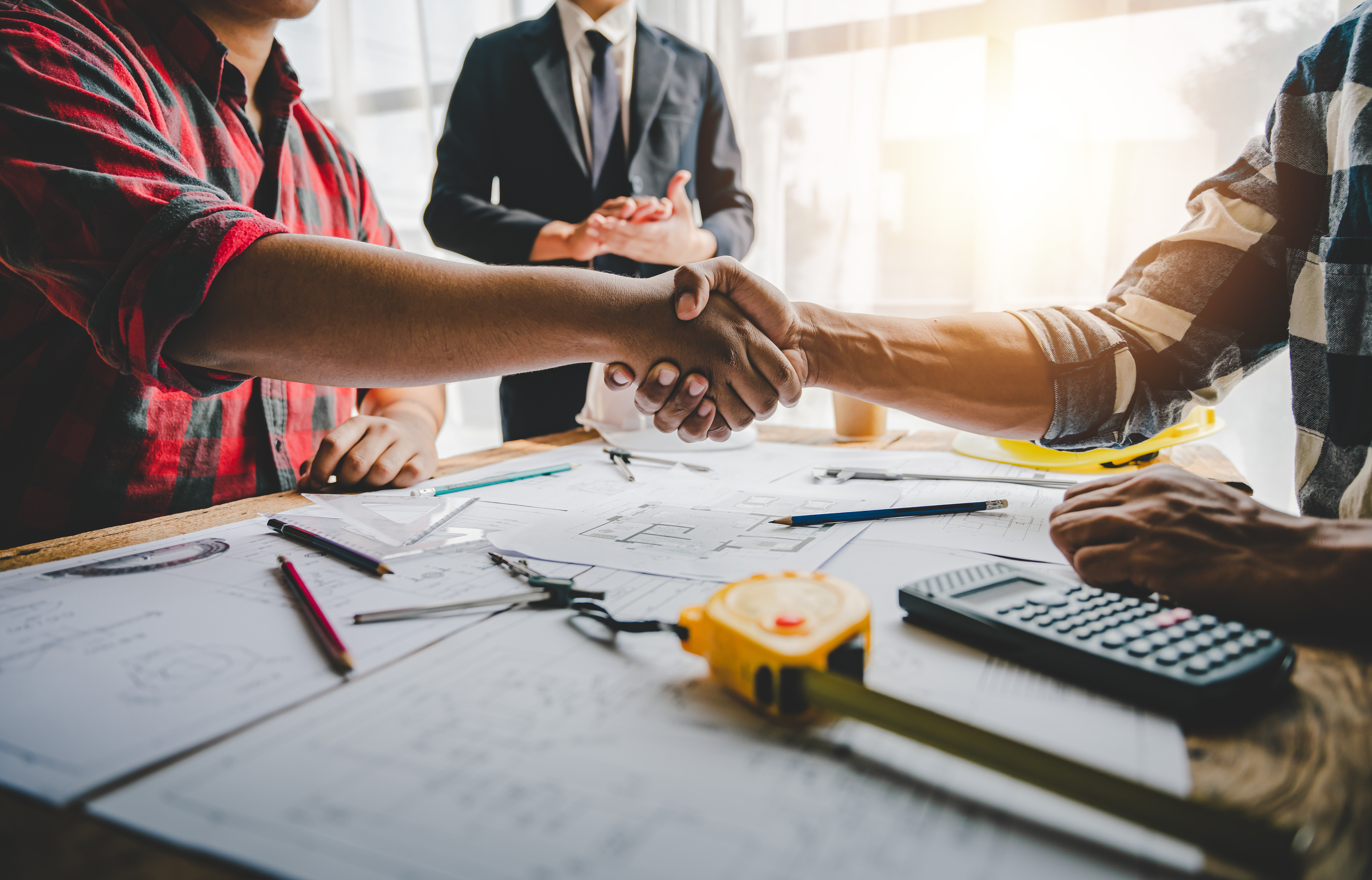 engineering team shaking hands start planning for architecture E